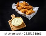 Chicken portion, fried chicken nuggets, burger portion, black background, isolated product, closeup