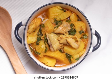 Chicken and Potato Curry with Basil Leaves in a Thai White Bowl - Shutterstock ID 2190814907