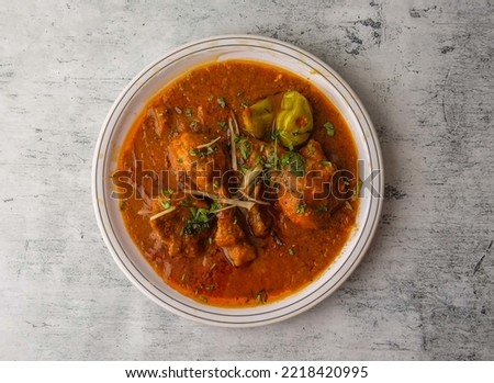 chicken red karahi served in a plate isolated on background top view of indian and pakistani desi food