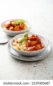Chicken with red sauce and rice