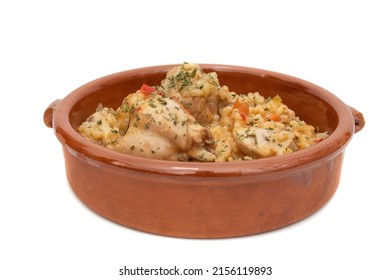 Chicken Rice Stew Served In A Clay Bowl, Isolated On White Background. Spanish Food Concept.	