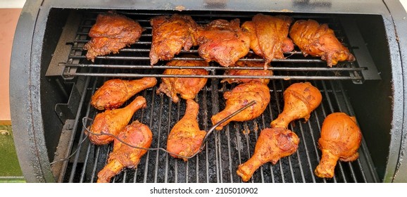 Chicken Roasting And Smoking Over Pellet Smoker Grill In Preparations For The New Year Cooked Golden Brown With Seasoning Sauce And Crispy Skin