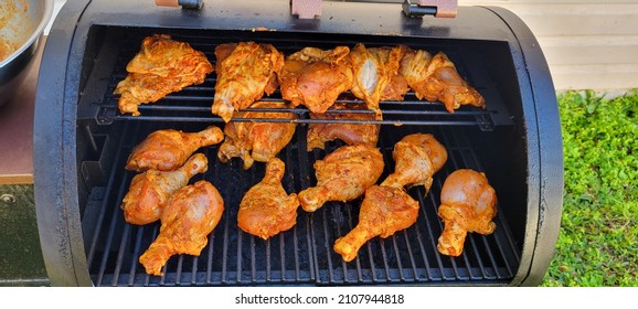 Chicken Roasting And Smoking Over Pellet Smoker Grill In Preparations For The New Year Cooked Golden Brown With Seasoning Sauce And Crispy Skin