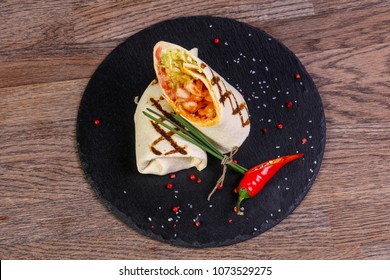 Chicken roll with tortilla served pepper