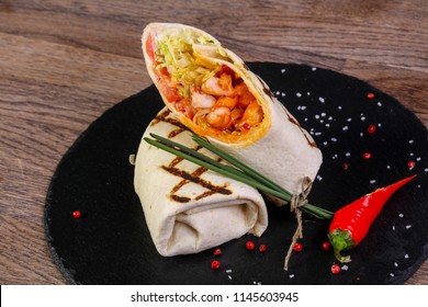 Chicken roll with tortilla served pepper