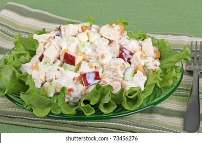 Chicken Salad With Apple Pieces On Top Of A Lettuce Leaf