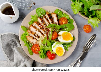 Chicken salad with leaf vegetables, chard, eggs, bulgur and cherry tomatoes
