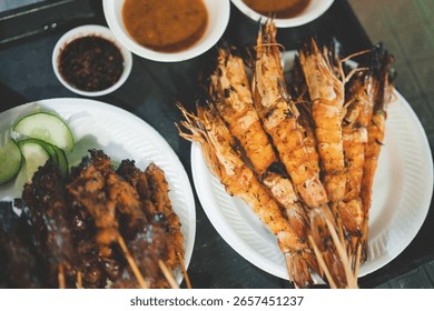 Chicken satay, beef satay and king prawn skewers at Satay By the Bay, Singapore