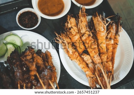Chicken satay, beef satay and king prawn skewers at Satay By the Bay, Singapore