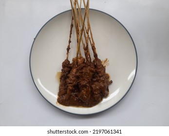 Chicken Satay (sate Ayam) Dish With Peanut Sauce On Plate Top View On White Background. Restaurant Background Concept, Culinary, Breakfast, Lunch, Dinner, Diet, Lifestyle, Eat, Snack, Healthy Food