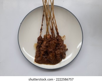 Chicken Satay (sate Ayam) Dish With Peanut Sauce On Plate Top View On White Background. Restaurant Background Concept, Culinary, Breakfast, Lunch, Dinner, Diet, Lifestyle, Eat, Snack, Healthy Food