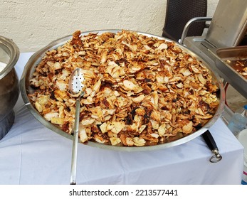 Chicken Shawarma In A Large Iron Bowl. Traditional Turkish Food Doner Kebab. Fast Street Food