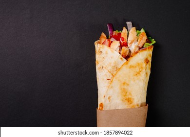 Chicken Shawarma On A Dark Background. Shawarma With Chicken In Pita Bread