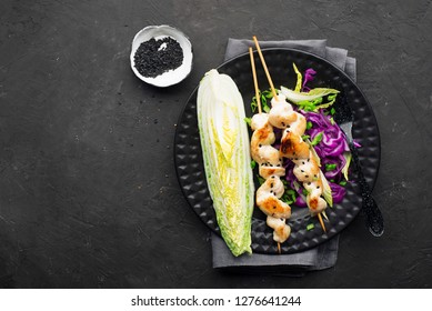 Chicken Skewers With Coleslaw On A Dark Background. Top View.