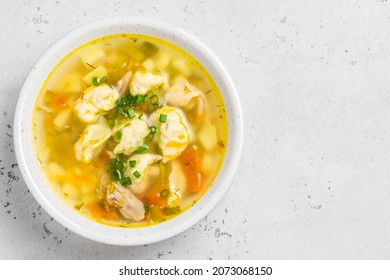 Chicken Soup With Dumplings And Chives. Top View, Copy Space.