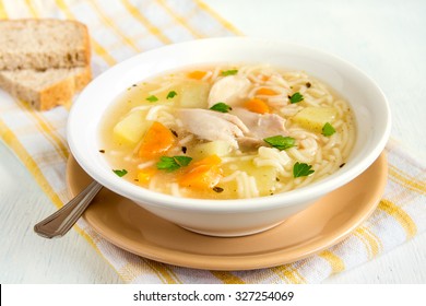chicken-soup-noodles-vegetables-white-260nw-327254069.jpg