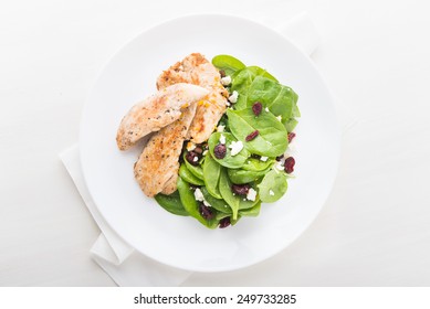 Chicken With Spinach Salad On White Wooden Background Top View. Healthy Food.