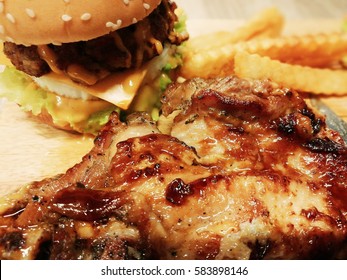 Chicken Steak + French Fries + Hamburger + Pork + Salad Combo Set With Barbecue Sauce. Junk Food. American/mexican Style. Unhealthy Lifestyle