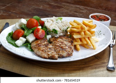 Chicken Steak With Salad Rice And French Fries
