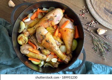 Chicken stew in a black cast iron pot - Shutterstock ID 189951230
