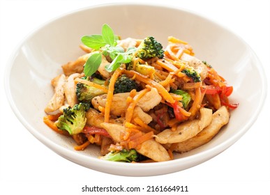 Chicken Stir Fry With Sweet Potato Noodles, Broccoli, Carrot And Bell Pepper, Isolated On White Background.