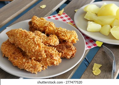 Chicken Strips On Plate And Boiled Potatoes