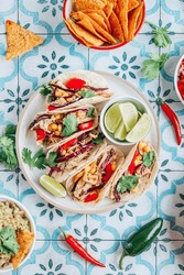 Chicken Tacos With Red Cabbage, Tomatoes And Corn Over Tiled Background. Top View