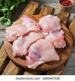 Chicken Thigh Fillet On Wooden Board. Rustic Style