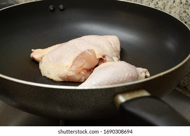 Chicken Thighs In A Fryer Pan