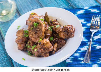 Chicken thighs marinated and cooked in adobo sauce
