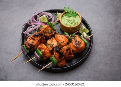 Chicken tikka, a delicious Indian appetizer! Marinated chicken cubes (aka kebabs), threaded on skewers and grilled to perfection - Chicken Tikka Kebab