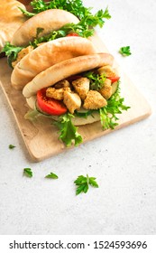 Chicken Tikka Naan Sandwich. Flatbread (naan, pita) sandwich with chicken and vegetables, copy space.