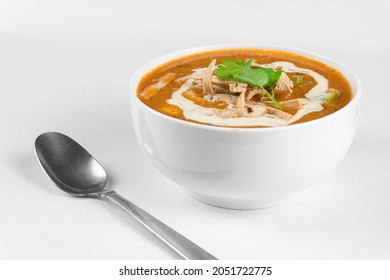 Chicken Tortilla Soup With Fried Strips Of Corn Tortillas. Mexican Soup On White Background