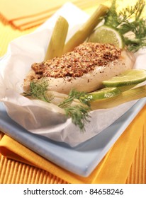 Chicken with traditional mustard cooked in wax paper