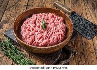 Chicken Or Turkey Mince Meat, Raw Poultry In A Wooden Plate. Wooden Background. Top View