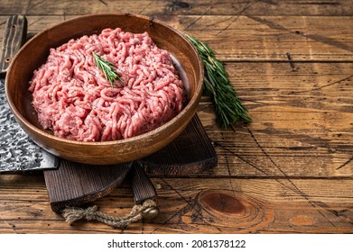 Chicken Or Turkey Mince Meat, Raw Poultry In A Wooden Plate. Wooden Background. Top View. Copy Space