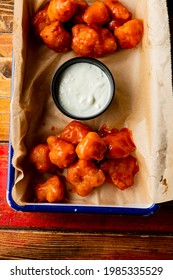 Chicken Wings. Boneless Chicken Wings Served Spicy Buffalo Wing Sauce And Honey Barbecue Sauce. Served With Ranch, Blue Cheese, Celery And Carrots. Classic American Style Bar Or Pub Favorite Fare.