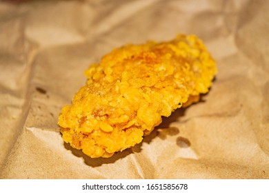 Chicken Wings Fried In Breadcrumbs On A Grey Paper Background. Close Up.