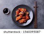 Chicken wings. Traditional asian recipe. Dark background. Top view.