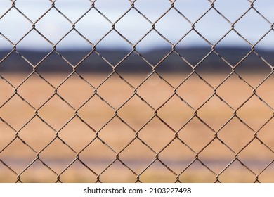 Chicken Wire Pattern Closeup With Brown Background