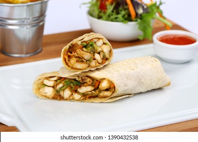 Chicken wrap sandwich with french fries, vegetable and sauce
