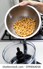 Chickpea In A Bowl And Food Processor For Making Hummus.