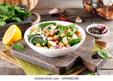 A Chickpea (Garbanzo Bean) Salad On A Plate On A Wooden Table.