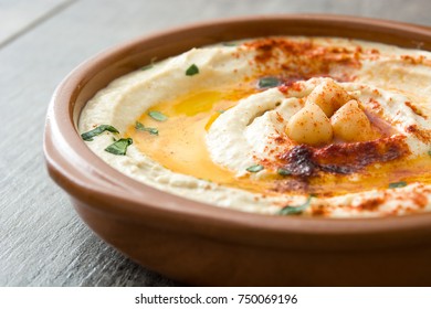 Chickpea Hummus In Bowl On Wooden Table.