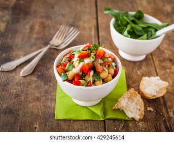 Chickpea Salad In A Bowl With Tomato, Onion And Basil