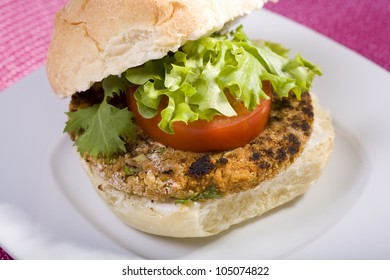 Chickpea Vegan Veggie Burger On A Kaiser Roll With Lettuce Tomato And Vegan Mayo