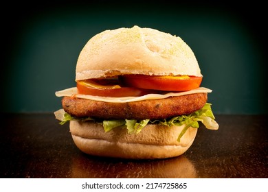 Chickpea Veggie Burger On Wooden Table Green Background