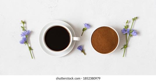 Chicory drink, chicory powder in a bowl and blue flowers on a white background. Herbal coffee substitute. View from above. Banner. - Shutterstock ID 1852380979