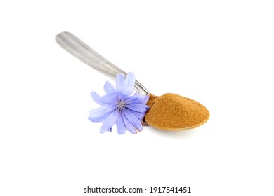 Chicory Root Powder In Spoon And Blue Flower Isolated On White Background. Chicory Coffee, Organic Food Additive. Roasted Chicory Root Powder