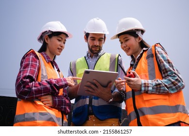 Chief Engineer Talking With Team Members Holding Tablet.Supervisor Construction Worker Do Job Training.Group Of Asian,American,Middle East,diversity,AAPI.Project Mechanic Smart Management,technology.